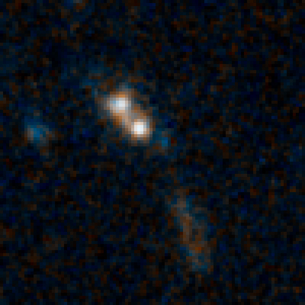Две белые точки являются ядрами двух галактик. Видны два шлейфа материи, оторванные от галактик. Коричневые области - пыль и старые звезды. Голубые - районы звездообразования.